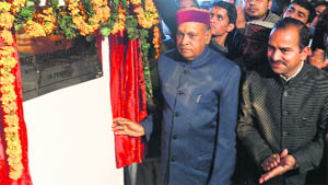 Former Chief Minister PK Dhumal inaugurates a hotel in Palampur on Saturday. 