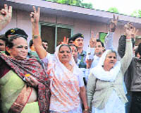Relatives of Parliament attack martyrs in New Delhi on Saturday. 