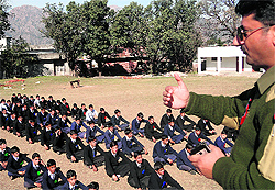 Reasi DSP, Mohammad Shafi addresses students during an awareness programme in Reasi on Saturday