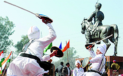 Young boys perform gatka, an ancient form of Sikh martial arts, on 167th martyrdom day of Sikh general Sham Singh Attari in Amritsar on Sunday