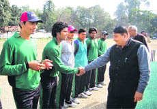 Team spirit: Umesh Sharma, Raipur MLA, being introduced to players on the opening day of the 5th All-India Shaheed Girish Bhadri Memorial Cricket Tournament in Dehradun on Sunday.