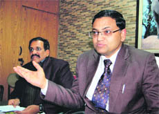 R K Mishra, Field Director, Corbett Tiger Reserve, addresses mediapersons in Dehradun on Sunday. Satish Updhayaya, the reserve Warden, is also seen in the picture.