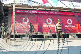 Security personnel patrol Srinagar on the second day of the curfew on Sunday