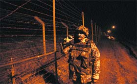 A jawan patrols along the Line of Control in Jammu