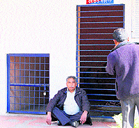 NRI Gurdial Singh, who was illegally detained by police personnel, made to sit on the ground outside the lock-up in Lambra police station near Jalandhar on Saturday