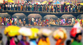 Devotees congregate at Sangam on the day of Mauni Amavasya during the Maha Kumbh in Allahabad on Sunday.
