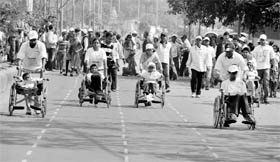 Mentally and physically challenged children compete in a wheelchair race in Siliguri on Sunday. Eighty-four children from West Bengal took part in the event.