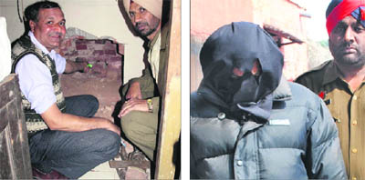 Railway officials show the hole in the wall from where Ashok Kumar, an employee, gained entry into the office of Traffic Inspector to steal cash at the railway station; and (right) Ashok Kumar in police custody in Amritsar on Monday.