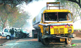 The mangled remains of the car and the gas tanker that collided on Goniana-Bajakhana road on Monday.