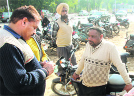 MC officials at the parking lot of the new courts complex in Sector 43, Chandigarh, on Monday.