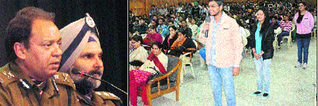 UT Inspector General Rajender Pal Upadhyaya and UT SSP Naunihal Singh interact with students at the Shri Guru Gobind Singh Khalsa College for Women, Sector 26, Chandigarh, and (right) a student puts up a query on Monday.