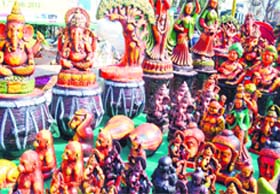 Idols made of terracota draw attention at a trade fair in Haridwar on Monday