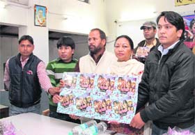 Senior Congress leaders Upender Thapli and his wife Godawari Thapli release a new Garhwali film album in Dehradun on Monday