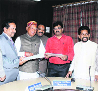 State Assembly Speaker Govind Singh Kunjwal after signing an MoU with the National Building Construction Company in Dehradun on Monday. 