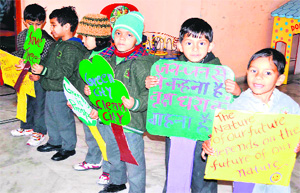 KG children generate awareness about environment conservation through placards in Haridwar on Monday