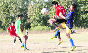 Players in action in a match in the Narayan Gurung Memorial Football Tournament played at Mahendra Ground in Dehradun on Monday. 