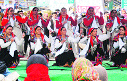 Local artistes perform on stage at the Mall Road in Manali on Monday.