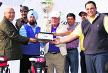 Chief Minister Bhupinder Singh Hooda hands over the HGA Haryana Open Golf Tournament-2013 Winners' Trophy to the ITC Classic Golf Resort team at DLF Golf and Country Club in Gurgaon on Sunday. 