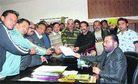 Members of the Jalandhar Professional Photographers Association present a memorandum to ADC Praneet Bhardwaj