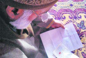 A member of Afzals family reads the letter