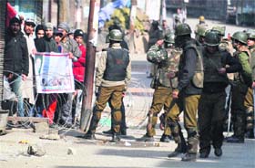 Activists of Jammu Kashmir Liberation Front raise slogans during a protest in Srinagar on Monday