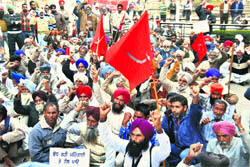Activists of kisan sabhas take part in a rally in Ludhiana on Monday. 