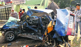 The mangled remains of the car involved in an accident near Kharar on Monday.