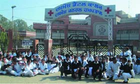 Students of nursing course sitting on dharna in front of the Dasmesh Dental College in Faridkot on Tuesday