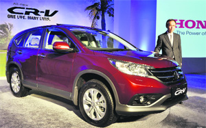 Honda Cars India president & CEO Hironori Kanayama at the launch of the 4th generation Honda CR-V in New Delhi on Tuesday. The SUV, which will be assembled in India for the first time at Hondas Greater Noida plant, will be available in two engine options  2.0L SOHC i-VTEC with 2WD and 2.4L DOHC i-VTEC with Realtime 4WD. It will be priced from Rs 19.95 lakh to Rs 23.85 lakh.