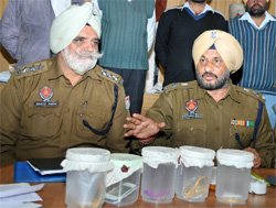 SSP Ravcharan Singh Brar (right) addresses a press conference in Bathinda on Tuesday.
