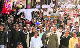 Shopkeepers take out a protest against the police and the civil administration in Dehradun on Tuesday.
