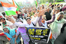 Members of the Jammu and Kashmir PoK Refugee Front protest in Jammu on Tuesday.
