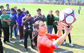 A student of DAV College participates in a Score a basket game during the annual athletic meet in Jalandhar on Tuesday.