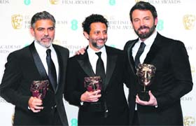 Actors George Clooney, Grant Heslov, and Ben Affleck pose with Best Film Award for Argo at the BAFTA Film Awards in London on Sunday