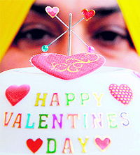 Miniature artist Harwinder Singh Gill shows his piece on the eve of Valentines Day in Amritsar on Wednesday