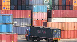 A truck ferries a shipping container at a port in Chennai. India posted its second highest ever monthly trade deficit of $20 billion in January, piling pressure on a widening current account deficit and limiting scope for the central bank to cut interest rates.  Reuters