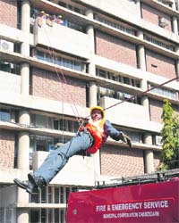 A person is being rescued from a building during a mock drill at the UT Secretariat in Chandigarh on Wednesday