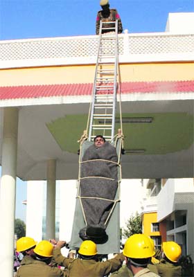 Rescue time: A commando demonstrates a rescue operation at Government College for Women in sector 14, Panchkula