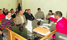 Dehradun District Magistrate BVRC Purushottam meets striking LPG dealers in Dehradun on Wednesday.