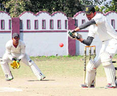 A batsman in action in a match during the 61st Dehradun District Cricket League in Dehradun on Wednesday. 