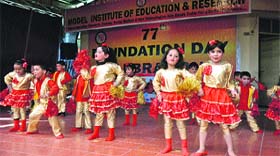 Children perform on the stage during the Annual Day function of Model Institute of Education & Research, BC Road, Jammu, on Wednesday