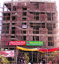 A florists shop, which has been allowed to run from an under-construction building in violation of norms, in Jalandhar on Wednesday
