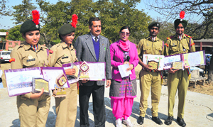 NCC cadets of Government Senior Secondary School, PAU, with their certificates and shields in Ludhiana on Wednesday.