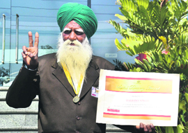Harbans Singh flashes the victory sign in Ludhiana on Wednesday.