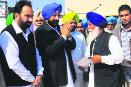 Congress MLA Balbir Sidhu (second from left) campaigns at a village in Moga on Wednesday. 