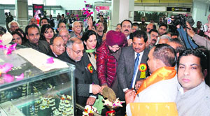 MPs Avinash Rai Khanna and Navjot Singh Sidhu, along with Congress MLA Om Parkash Soni unveil the model of Durgiana Temple at Sri Guru Ram Dass Ji International Airport in Amritsar on Thursday. 