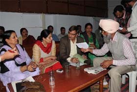 Retired headmaster Gurcharan Singh Sidhu (extreme right) speaks to additional director, Sarv Shiksha Abhiyaan, Parampal Kaur Maluka, in Bathinda on Thursday