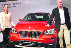 BMW Group India president Philipp von Sahr (R) and Bollywood actress Dia Mirza at the launch of the German auto majors entry level X1 SUV in Gurgaon on Thursday. Prices of the facelifed X1, rivalled by the Audi Q3 and Mercedes-Benz B Class, start at Rs 27.9 lakh. The 1 series will be assembled at BMWs Chennai plant and will be the sixth model to be assembled in India. Tribune photo