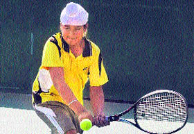 Yuvraj Singh plays a shot during the CLTA- AITA Chandigarh Talent Series Tournament at the CLTA, Sector 10, on Thursday.