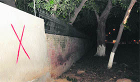 The cross mark on a boundary wall at Sector 5 in Chandigarh on Thursday.